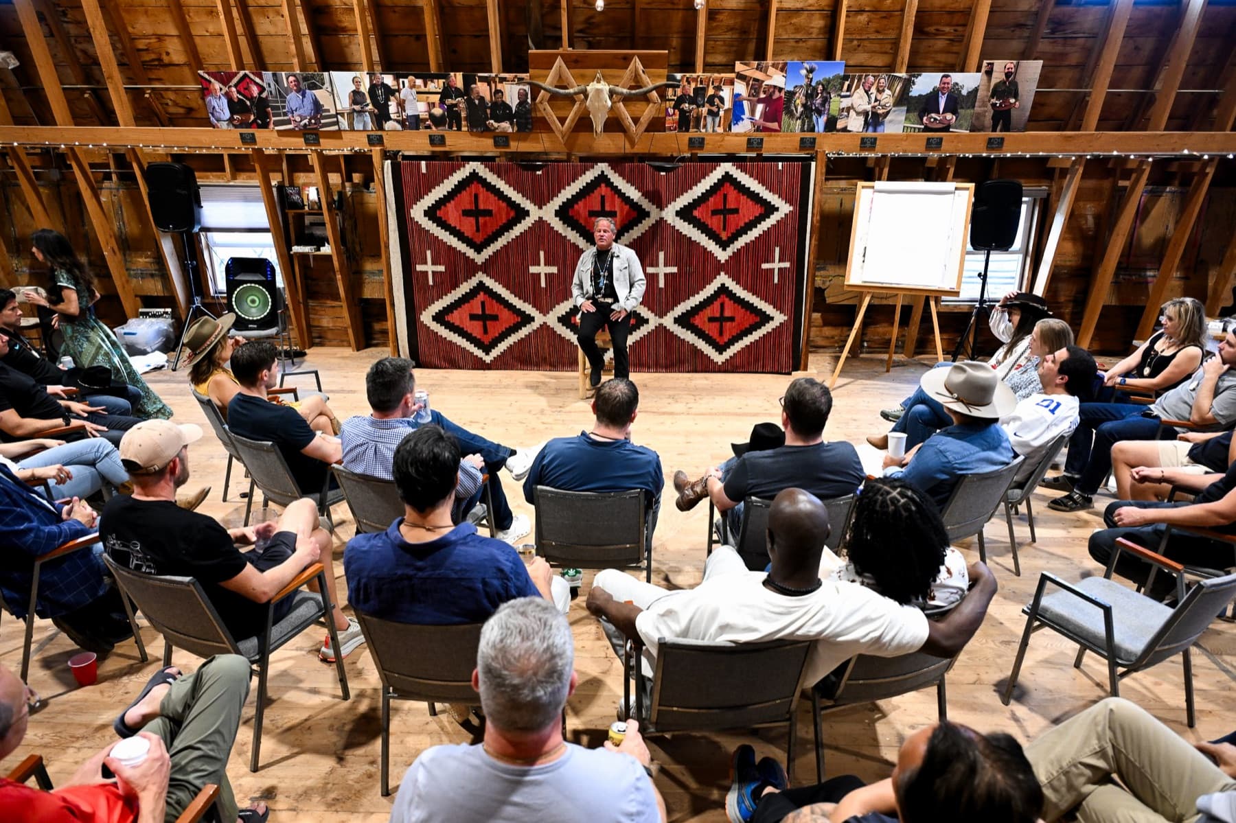 A faculty member speaking to students in the barn at Thunderhead Ranch